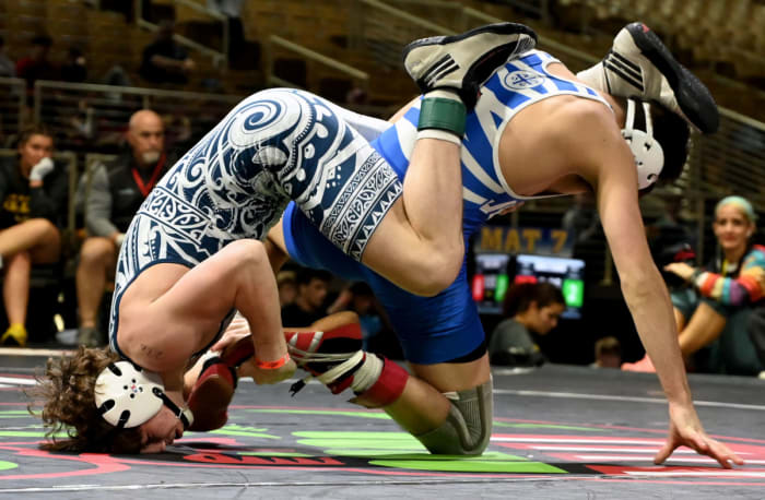 Teague Strobel of West Oak scores a 5-3 win against Roman Lermer of Tampa Jesuit during the 120-pound championship match on Saturday at the Knockout Christmas Classic at Silver Spurs Arena in Kissimmee.